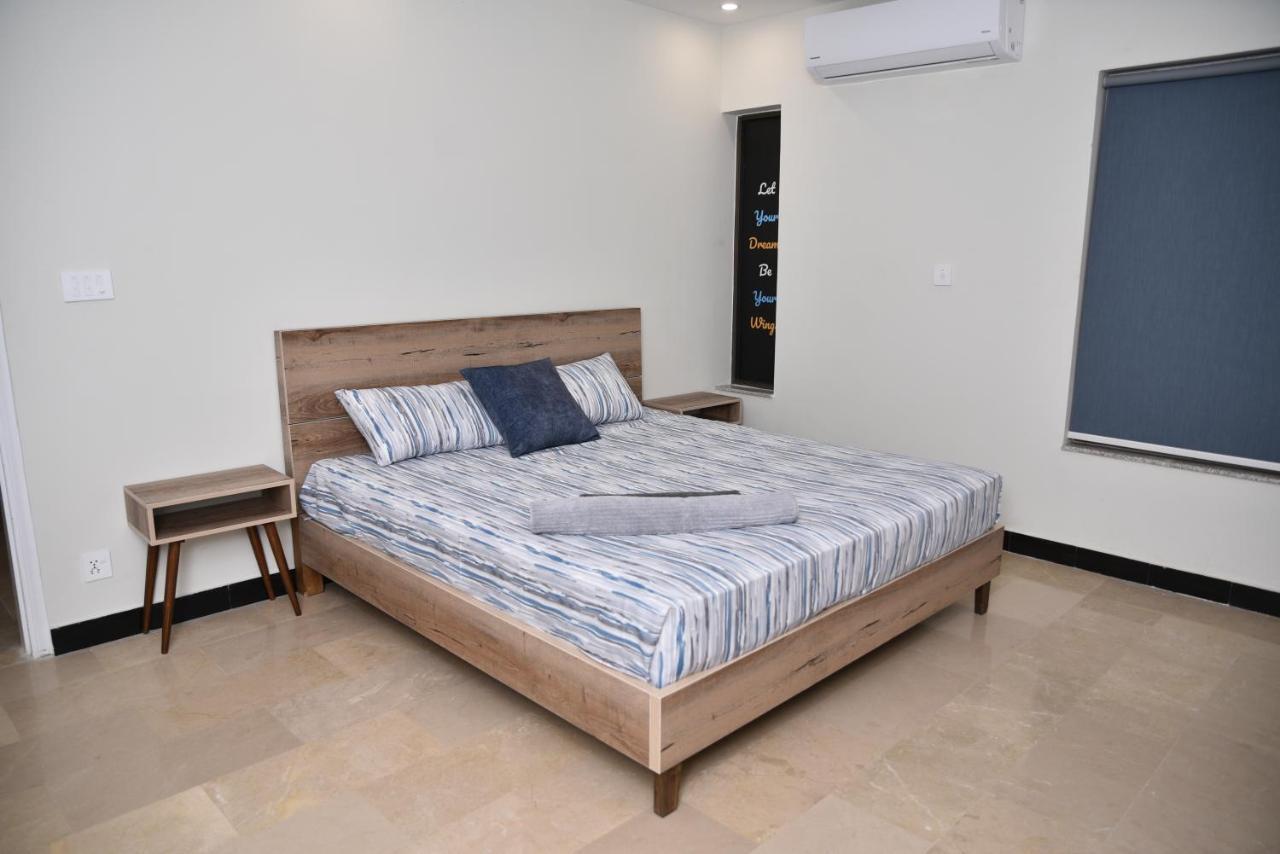 The Bliss Aparthotel Rawalpindi Bagian luar foto